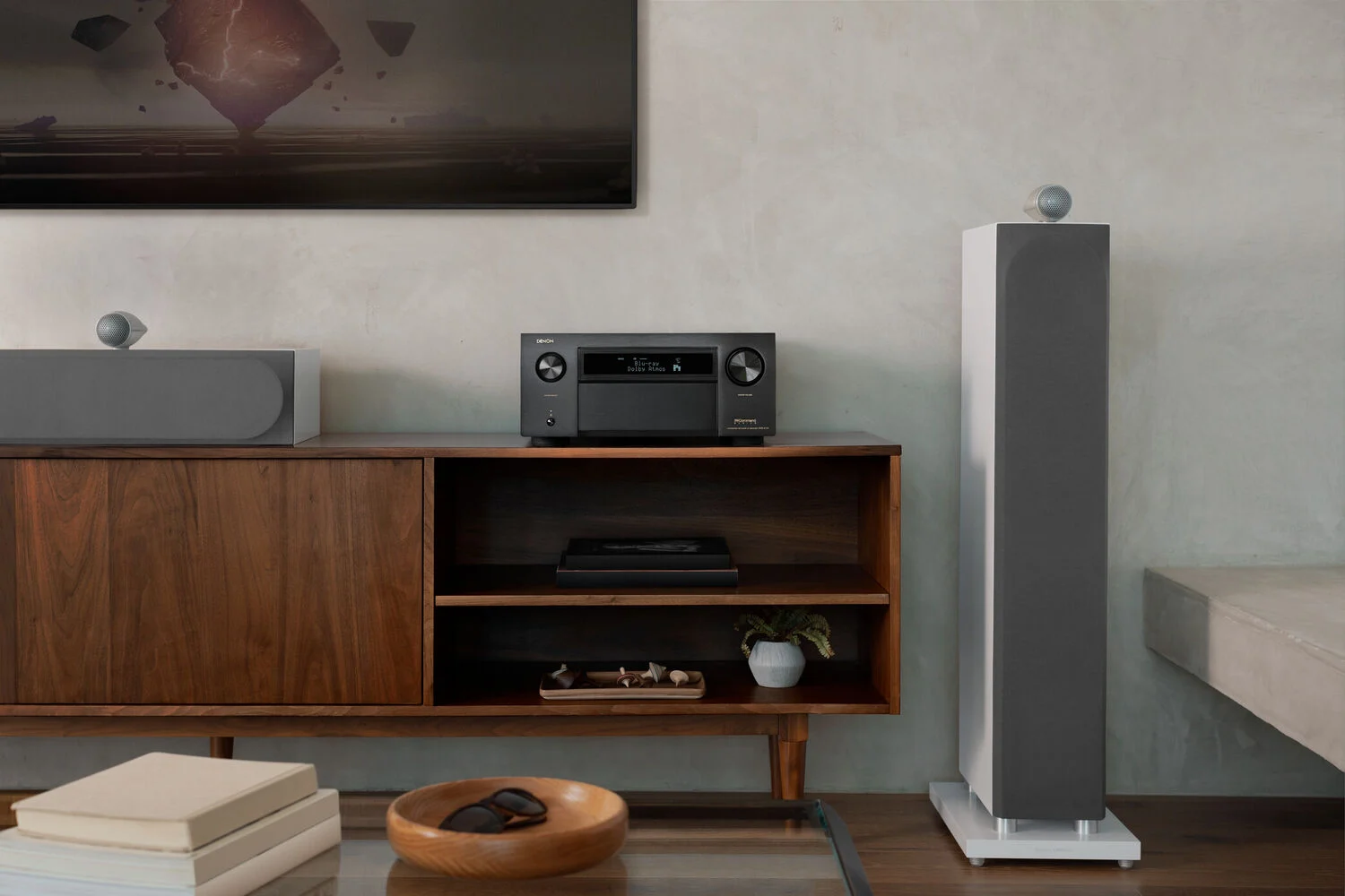 A-Series AVR sitting on a tv stand with LCR speakers